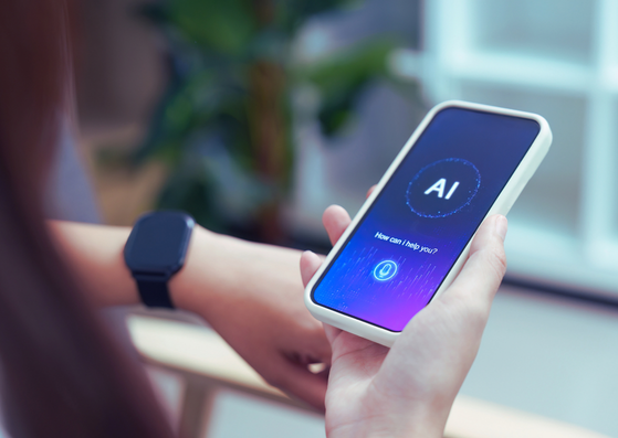 Person using an AI-powered mobile application, representing AI skills, digital literacy and the future of work